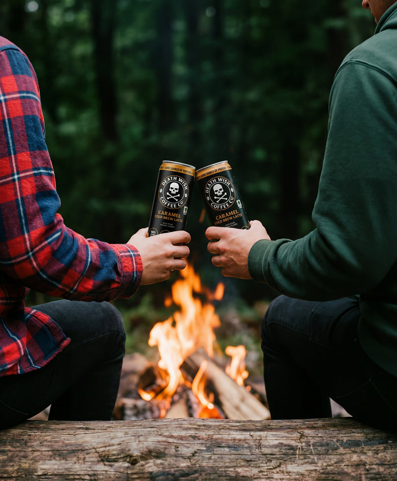Death Wish Coffee Cold Brew Latte cheers at a campfire.
