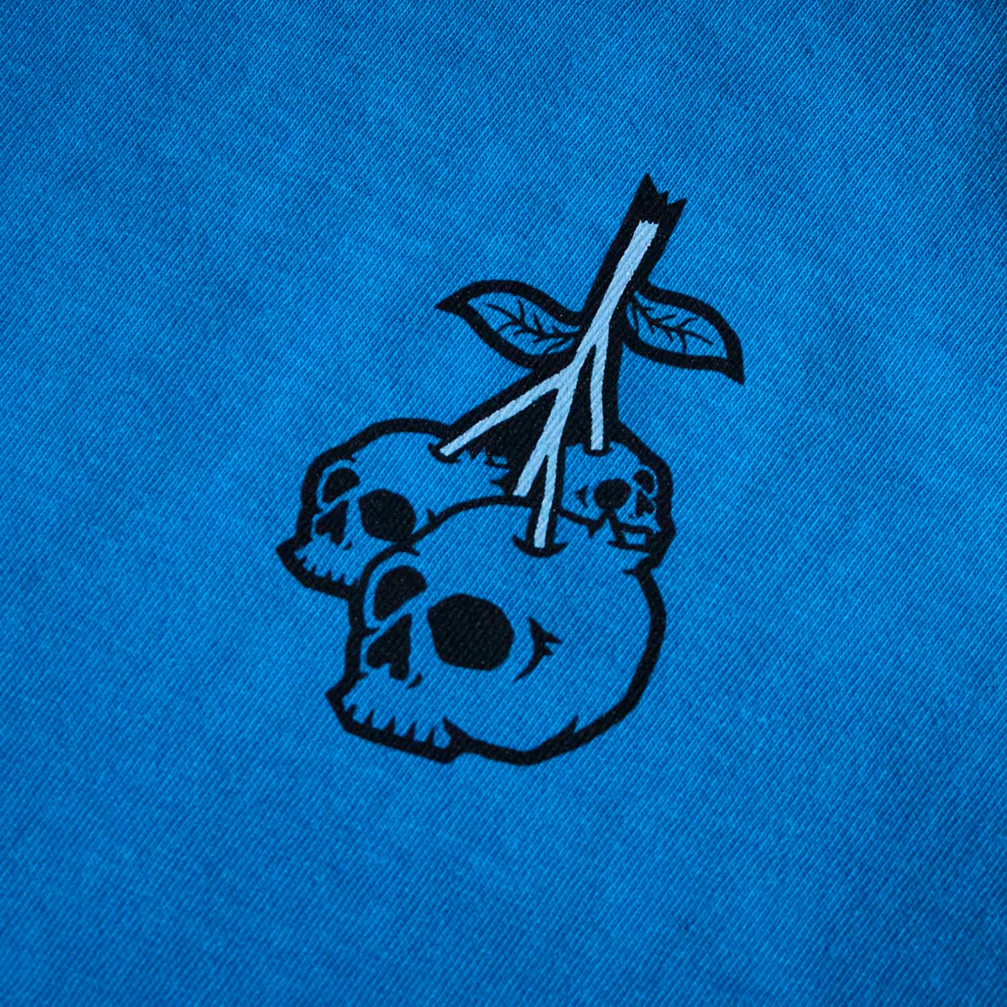 Up close of the front of the Death Wish Coffee Bury Your Blues Tee.