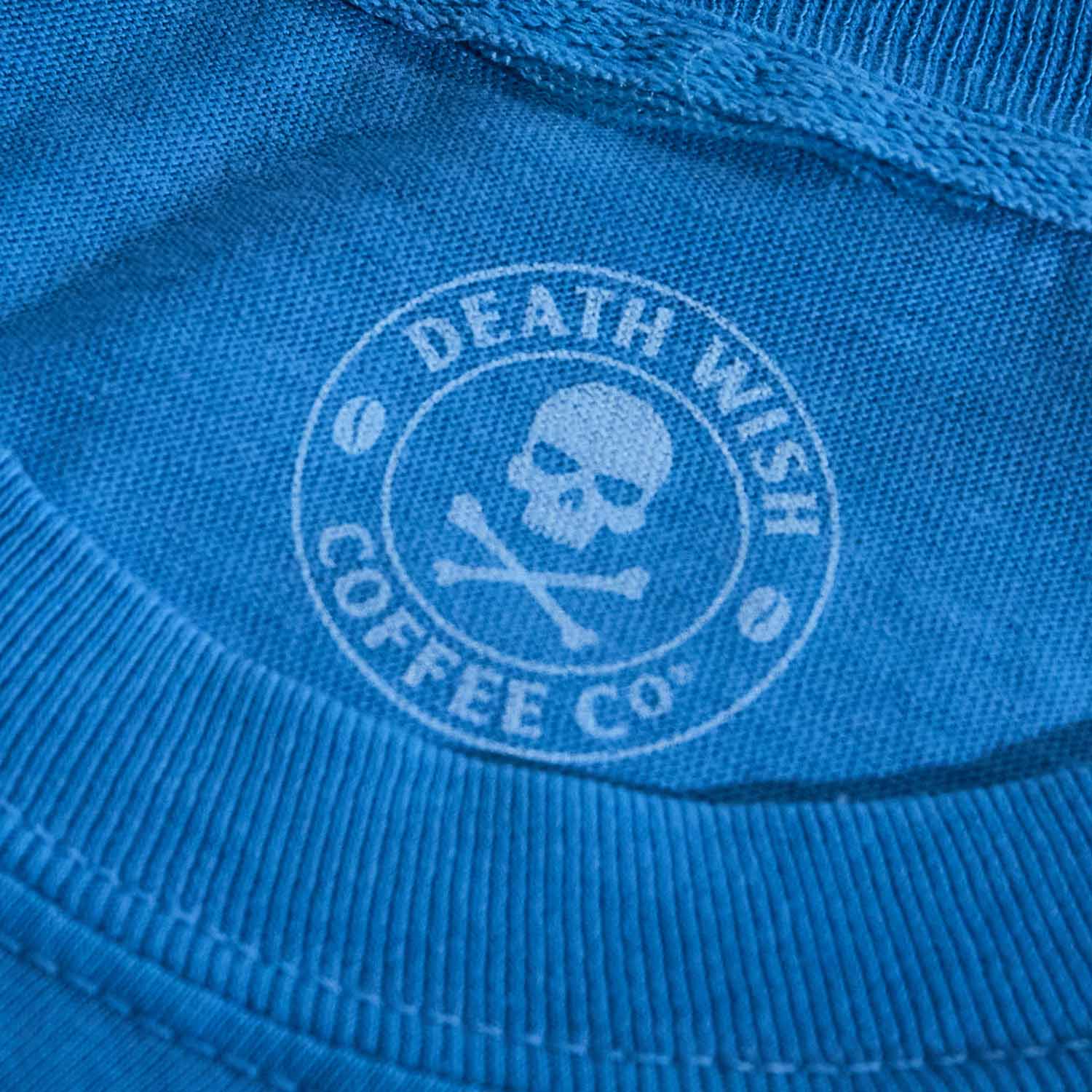 The inner neck label of the Death Wish Coffee Bury Your Blues Tee.