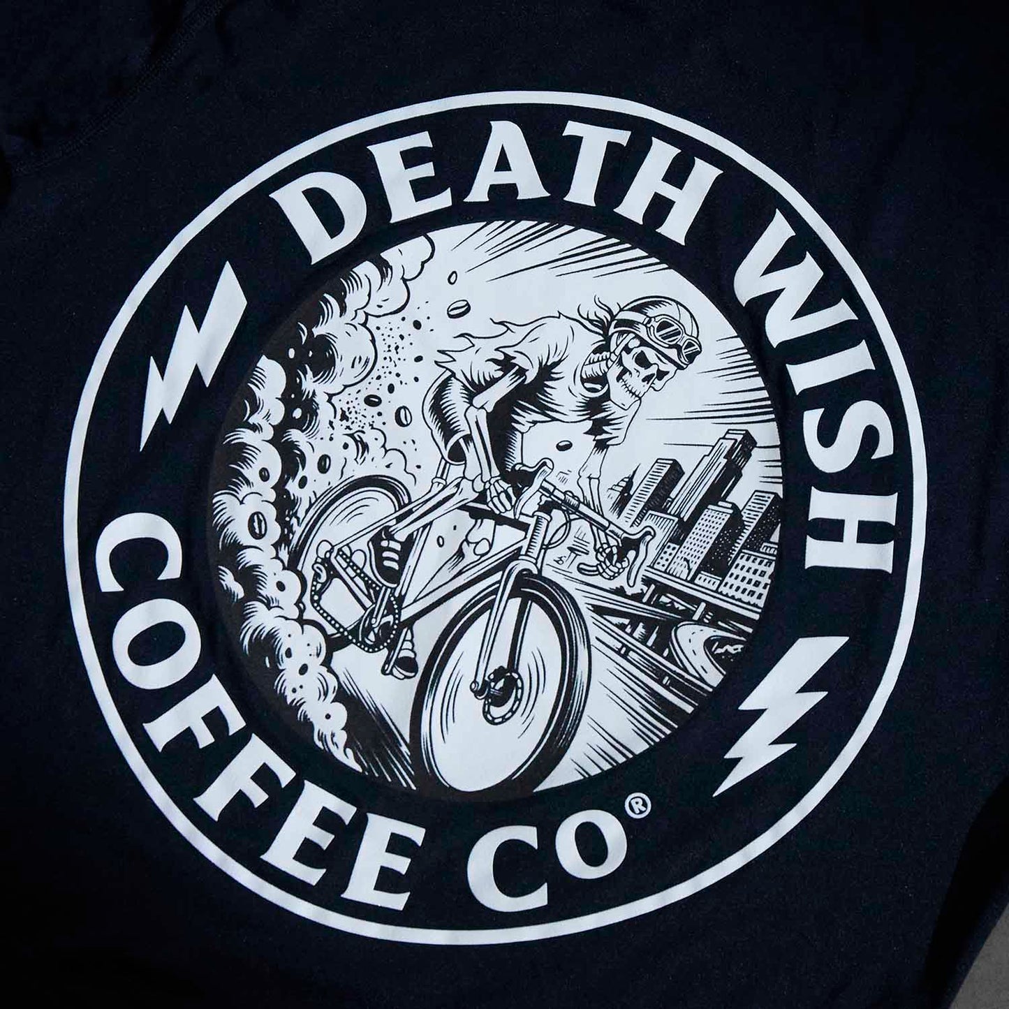 A detail shot of the Ride or Die Medallion on the Death Wish Coffee Bone Dry Cycling Jersey.