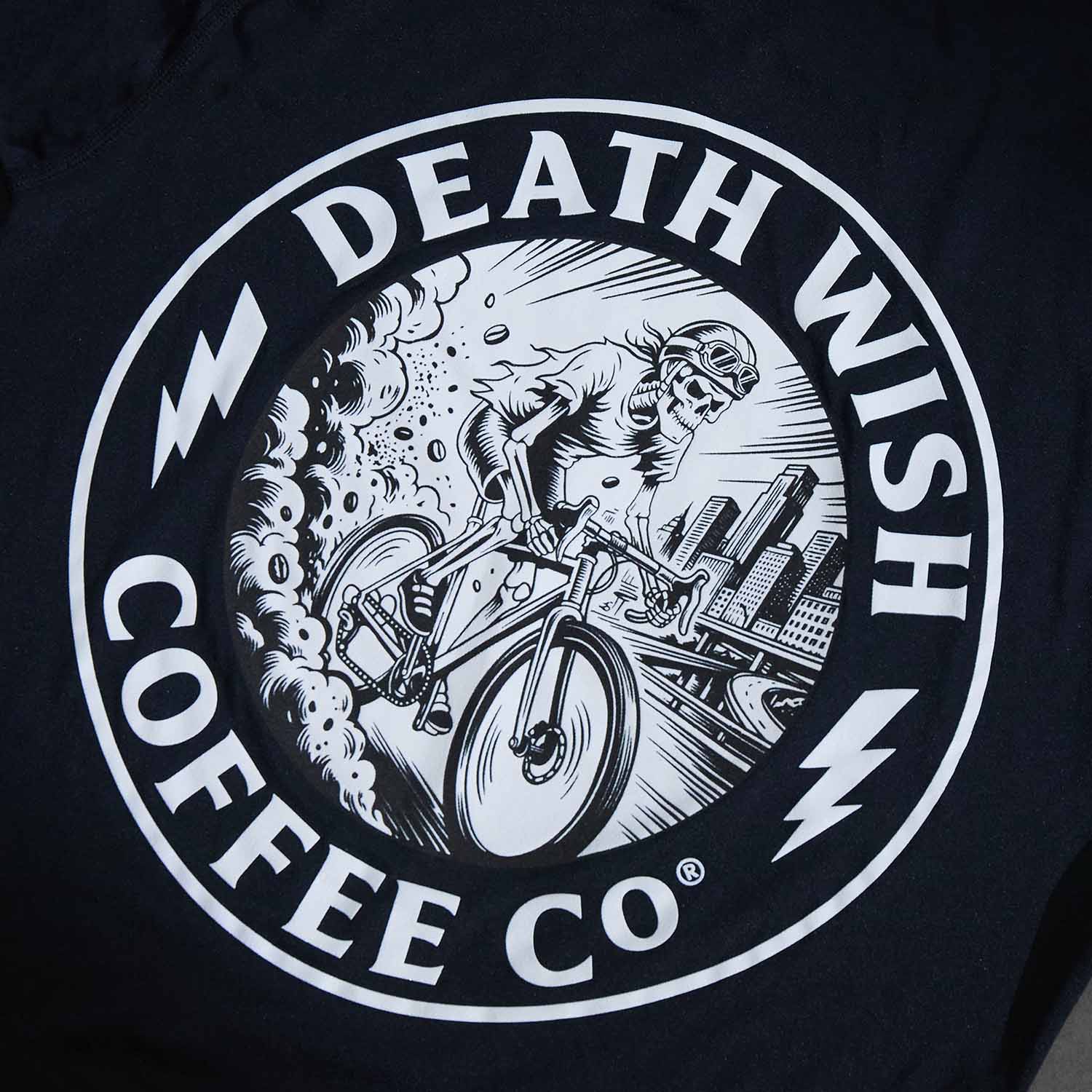 A detail shot of the Ride or Die Medallion on the Death Wish Coffee Bone Dry Cycling Jersey.