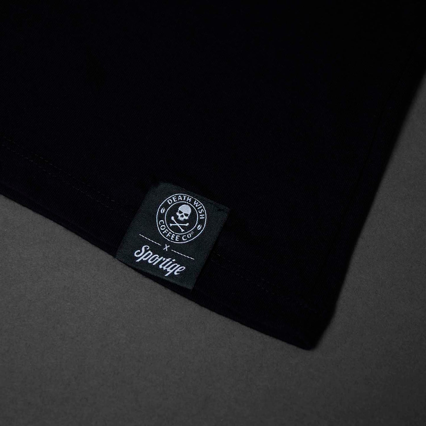 The woven tag on the Death Wish Coffee Society Insignia Tee.