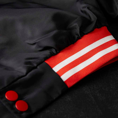 The bottom hem details of the Death Wish Coffee Level Up Letterman Jacket.