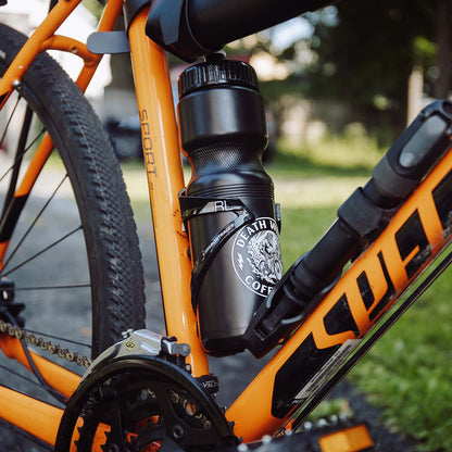 The Death Wish Coffee Go With the Flow Water Bottle on a bike.