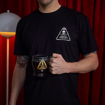 A model wearing the Death Wish Coffee Society Insignia Tee.
