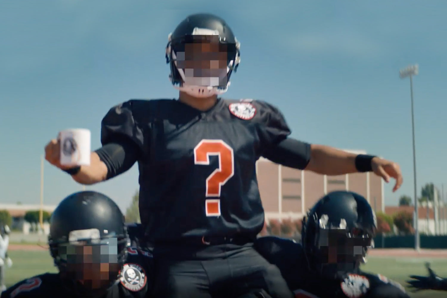 Unknown sponsored athlete being lifted on the shoulders of their teammates.