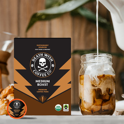 Pouring creamer into Medium Roast Death Wish Coffee.