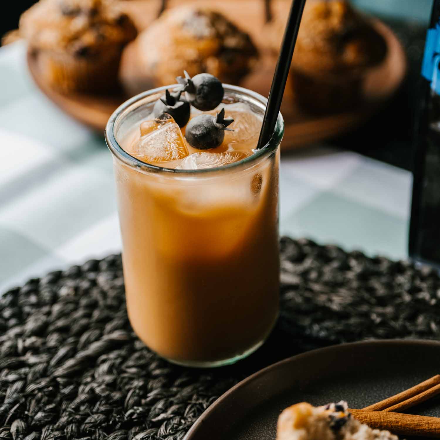 Blueberry Death Wish Coffee, iced with blueberries on top.